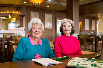 Two elderly women playing poker