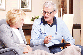 Doctor in discussion with elderly patient
